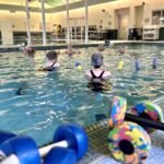 Seniors exercising in the pool at Evergreen Retirement Community.